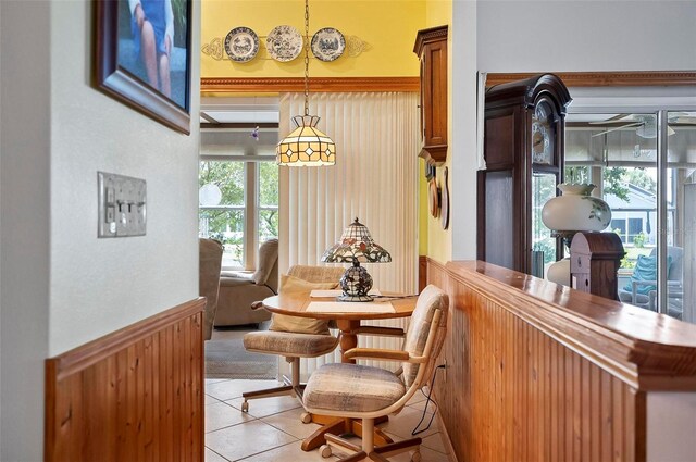 8 Sea Vista Dr, Palm Coast, FL 32137 - dining room with light tile patterned flooring and a bar