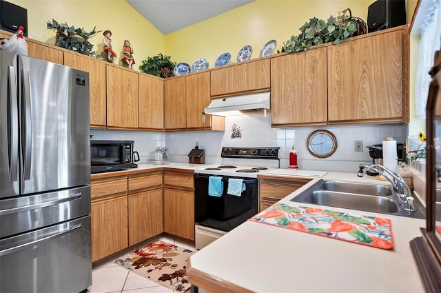 8 Sea Vista Dr, Palm Coast, FL 32137 - kitchen featuring a sink, freestanding refrigerator, white electric stove, black microwave, and under cabinet range hood
