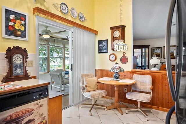 dining area with ceiling fan and light tile patterned flooring