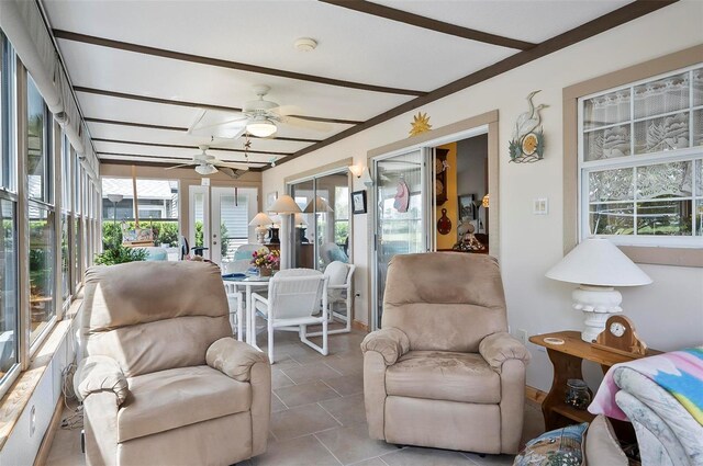 sunroom featuring french doors and ceiling fan