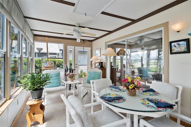 sunroom featuring ceiling fan