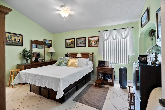 8 Sea Vista Dr, Palm Coast, FL 32137 - bedroom with a textured ceiling, baseboards, a ceiling fan, vaulted ceiling, and light tile patterned floors