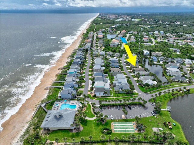 aerial view featuring a view of the beach and a water view