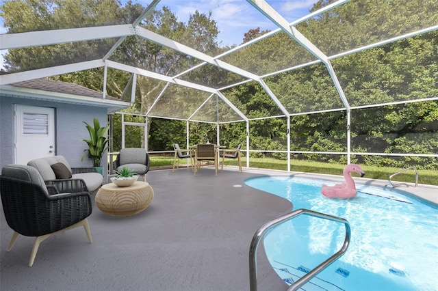 view of pool featuring a patio area and glass enclosure