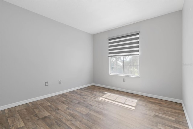 unfurnished room featuring hardwood / wood-style floors