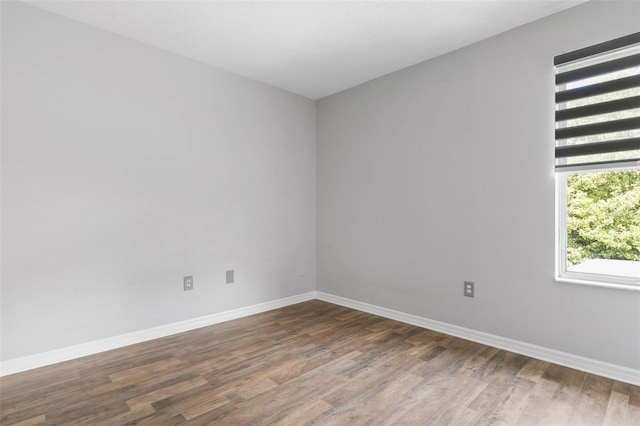 empty room featuring hardwood / wood-style flooring