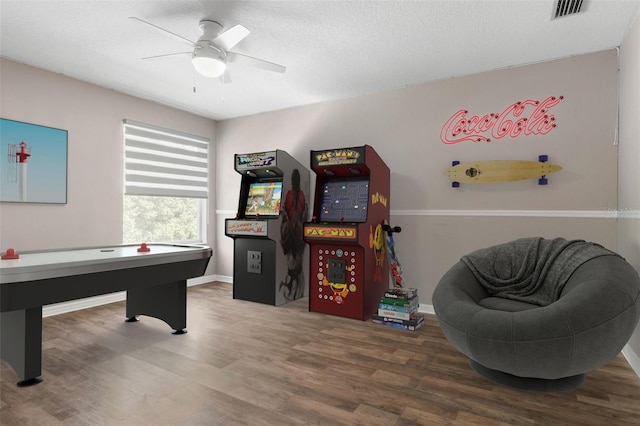 rec room with ceiling fan and wood-type flooring