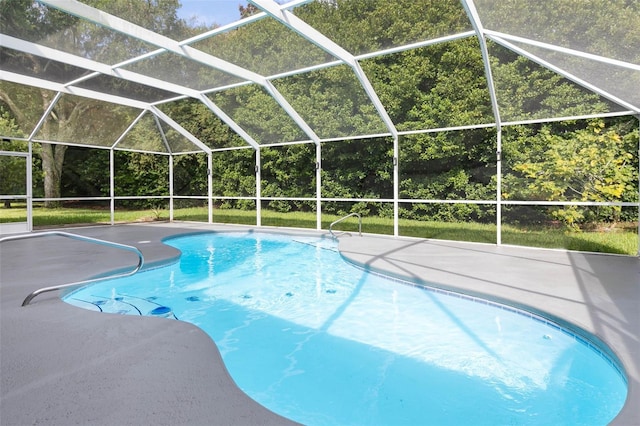 view of pool featuring a patio and glass enclosure