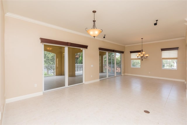 empty room with ornamental molding, an inviting chandelier, and a healthy amount of sunlight