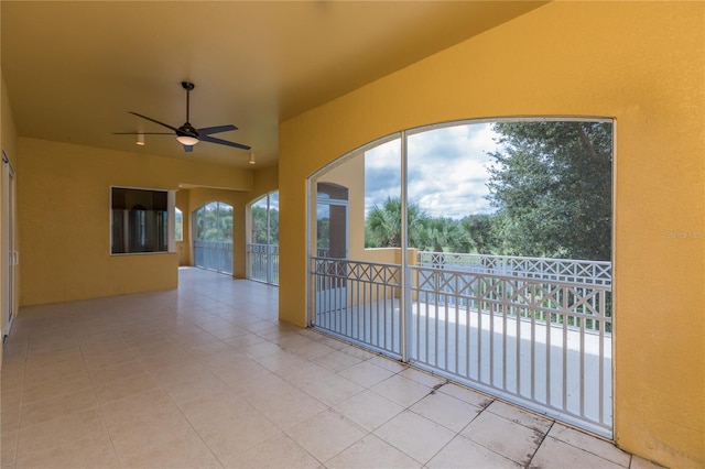 exterior space featuring ceiling fan