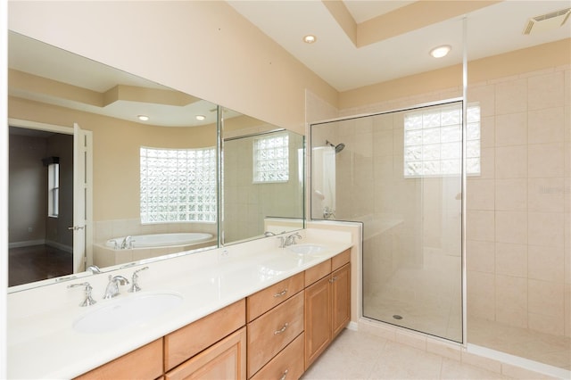 bathroom featuring tile patterned floors, independent shower and bath, and vanity