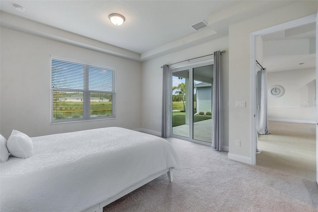 bedroom featuring carpet flooring and access to exterior