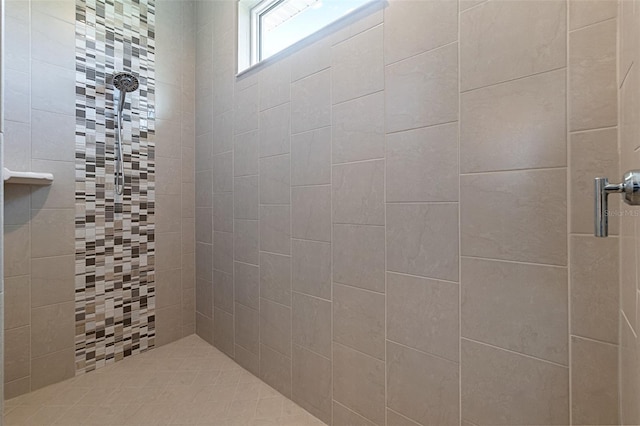 bathroom with tiled shower