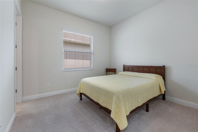 bedroom with light carpet