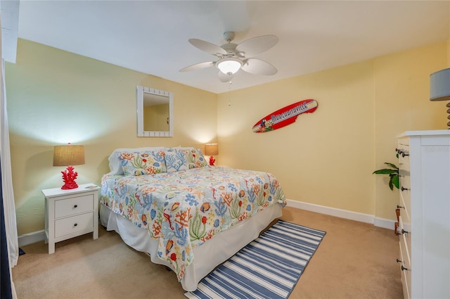 bedroom featuring ceiling fan and light colored carpet