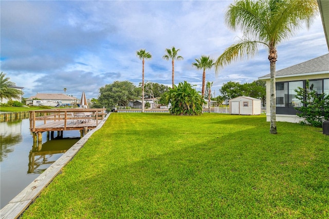 exterior space featuring a yard and a water view