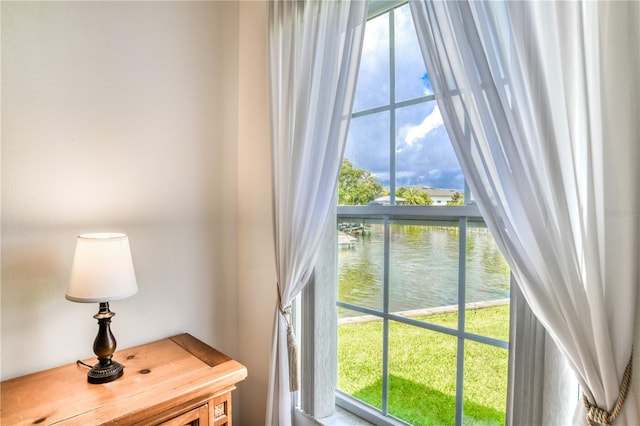 doorway to outside with a water view