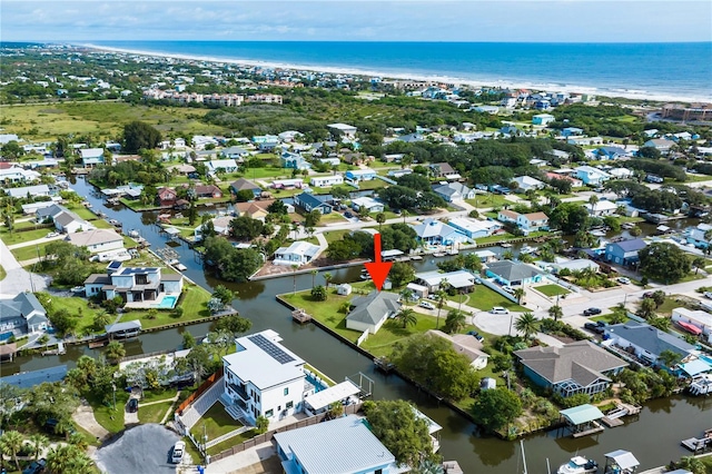 aerial view with a view of the beach and a water view