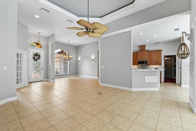 unfurnished living room with light tile patterned flooring, visible vents, and baseboards