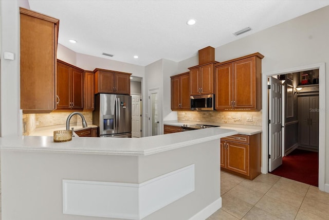 kitchen with light tile patterned floors, visible vents, appliances with stainless steel finishes, and light countertops