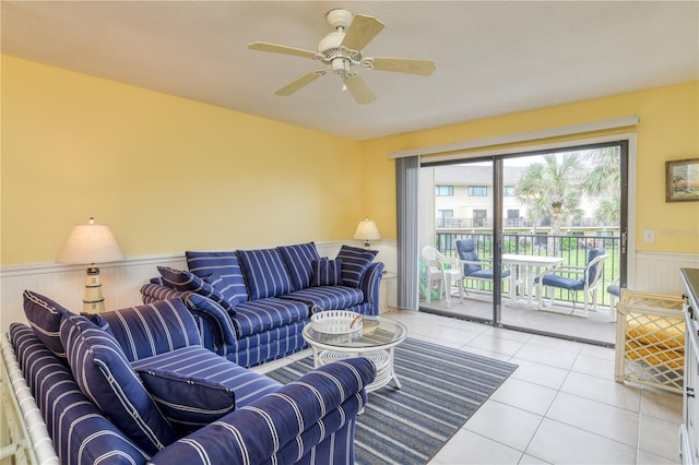 living room featuring ceiling fan and light tile patterned flooring