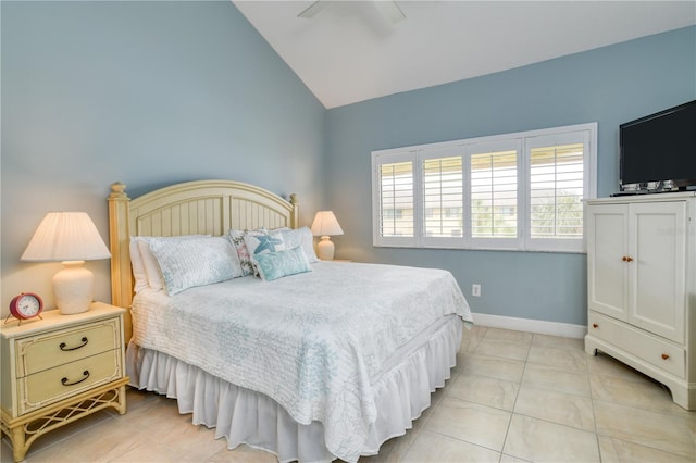 bedroom with lofted ceiling, light tile patterned flooring, and ceiling fan