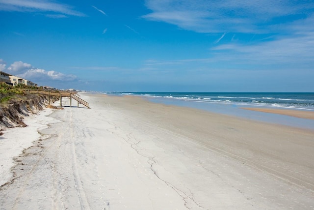 property view of water featuring a beach view