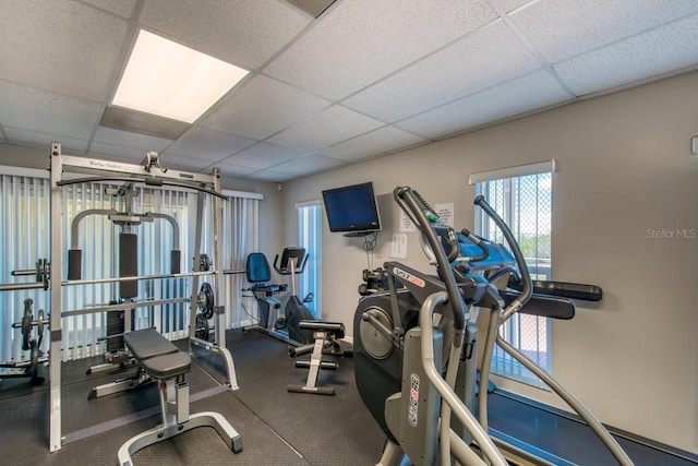 workout area featuring a drop ceiling