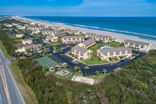 bird's eye view featuring a view of the beach and a water view