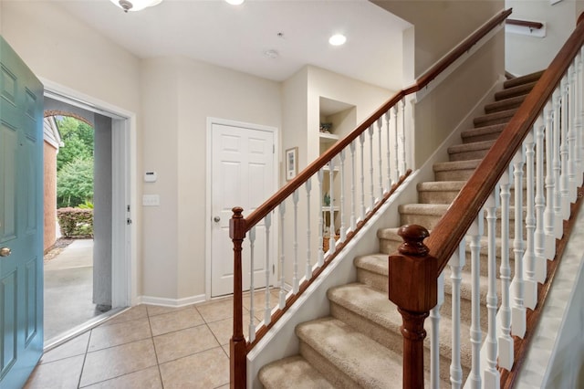 foyer entrance with light tile patterned floors