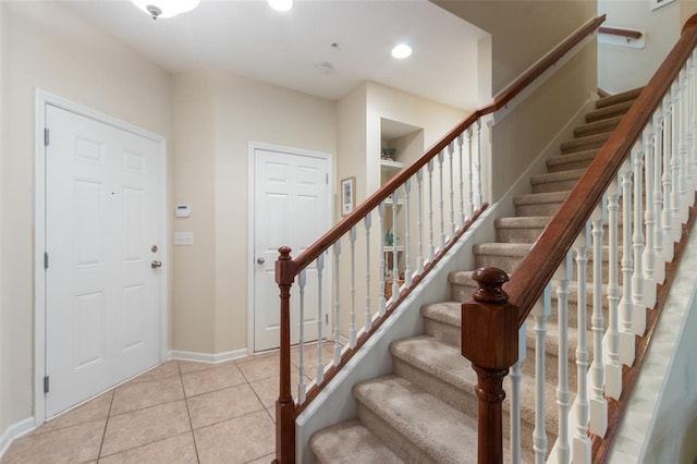 entrance foyer with light tile patterned floors