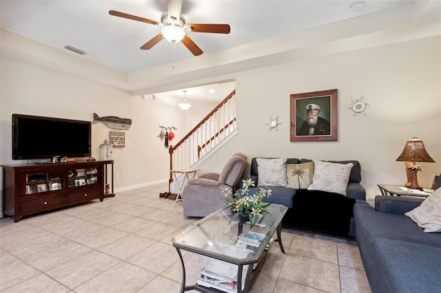 living room featuring ceiling fan and light tile patterned floors