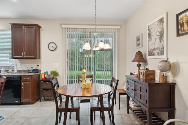 dining room featuring a chandelier and light tile patterned flooring