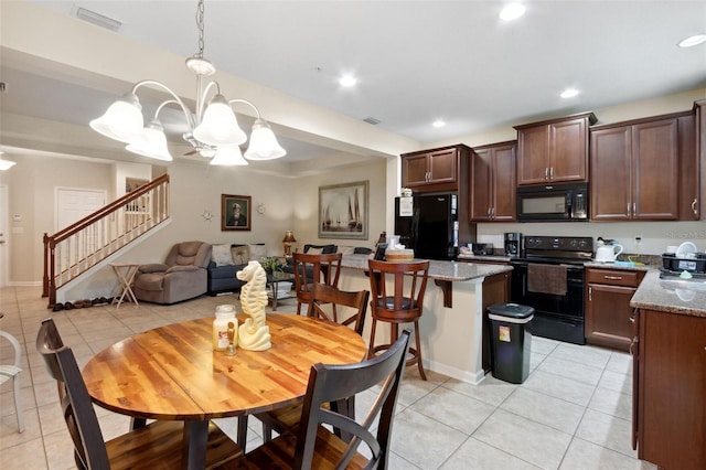 tiled dining space featuring a notable chandelier