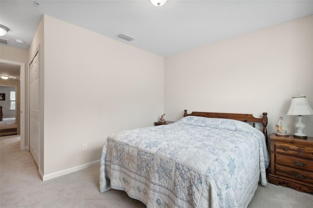 bedroom with light colored carpet