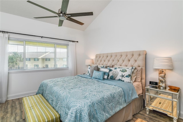 bedroom with lofted ceiling, ceiling fan, baseboards, and wood finished floors