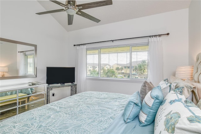 bedroom featuring lofted ceiling and ceiling fan