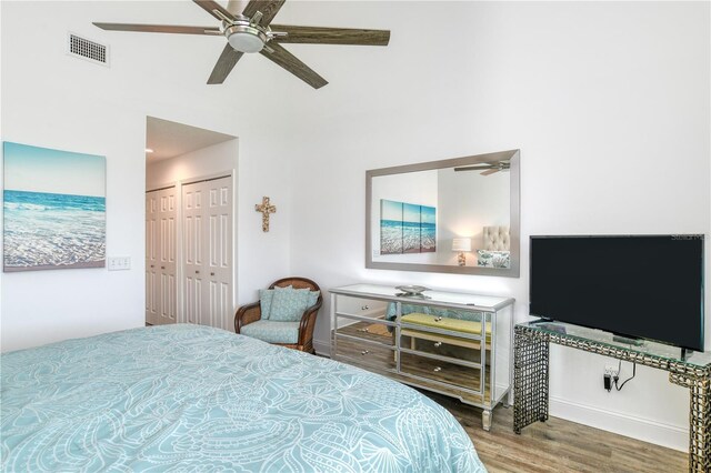 bedroom featuring hardwood / wood-style floors and ceiling fan