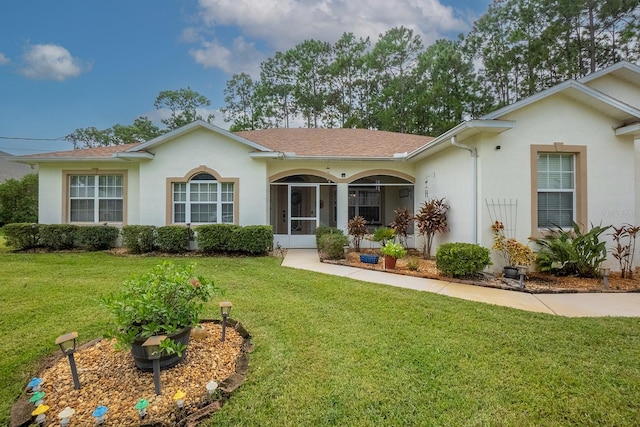 ranch-style house with a front lawn