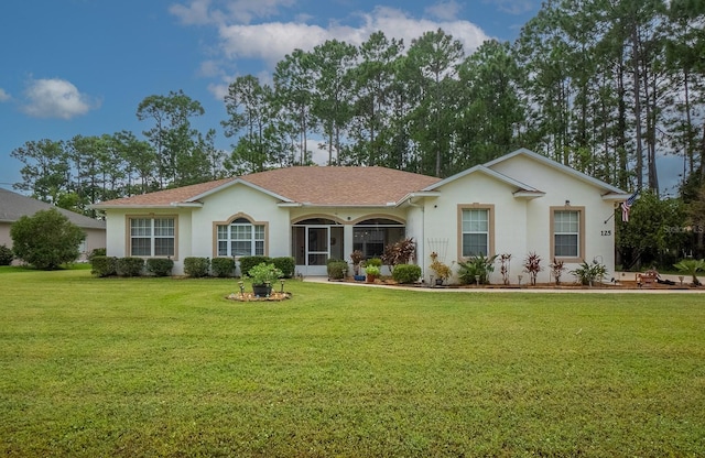 ranch-style home featuring a front lawn