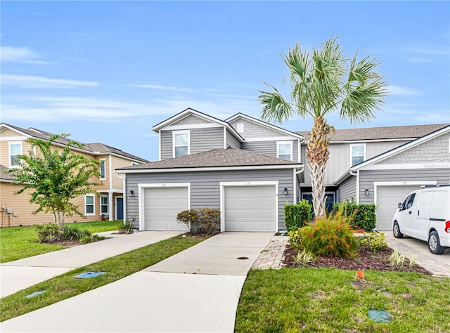 view of front of house featuring a front yard and a garage