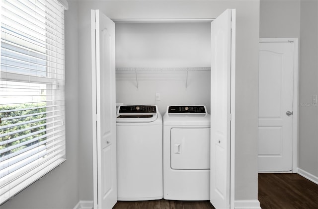 laundry room featuring washing machine and dryer, dark wood-style floors, and baseboards