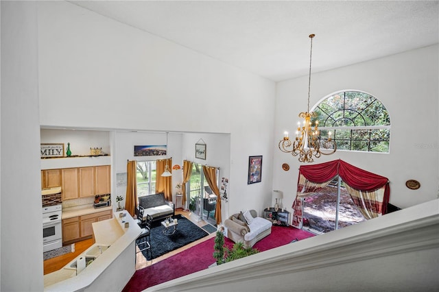 bedroom featuring wood-type flooring and a chandelier