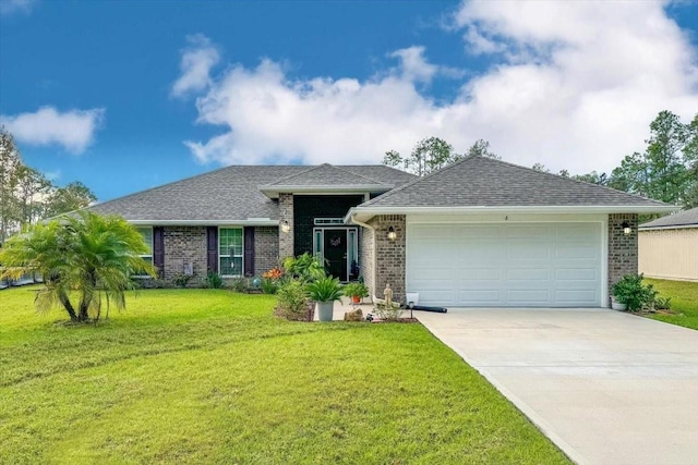 ranch-style home with brick siding, a garage, a front lawn, and driveway