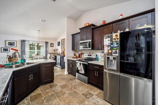 kitchen featuring vaulted ceiling, a notable chandelier, stainless steel appliances, sink, and dark brown cabinetry