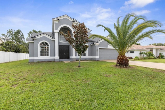 view of front of home with a garage and a front yard