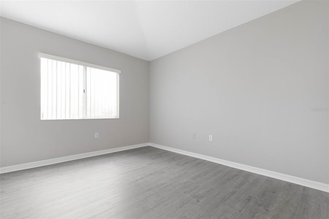 spare room with hardwood / wood-style flooring