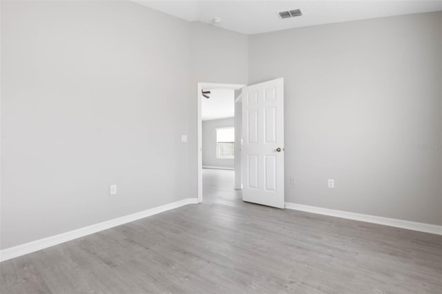 spare room featuring light hardwood / wood-style floors