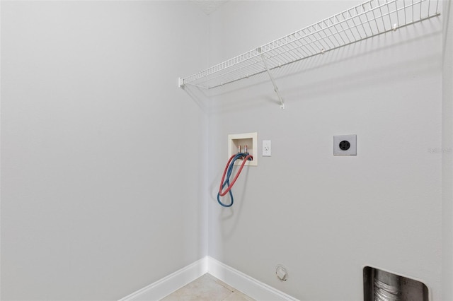 clothes washing area featuring tile patterned flooring, gas dryer hookup, electric dryer hookup, and washer hookup