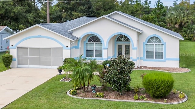 ranch-style home featuring a front yard and french doors